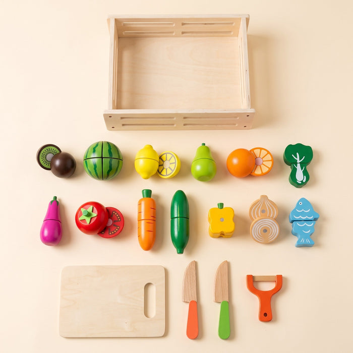 All pieces: a crate, 13 wooden foods including watermelon, onion and a fish, a cutting board, two knives and a peeler