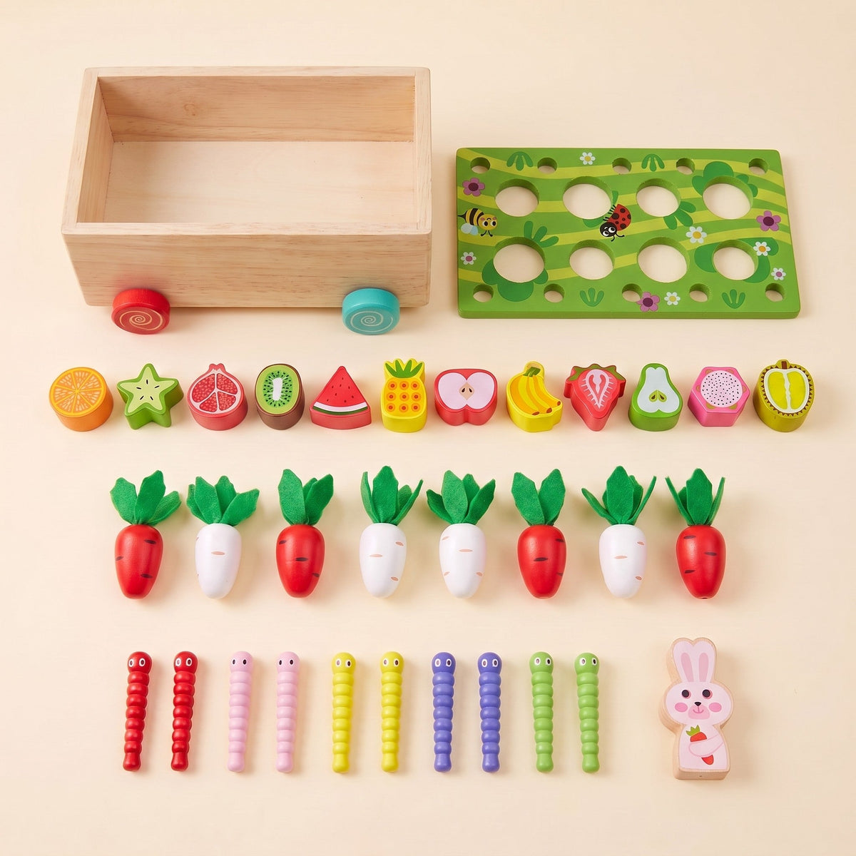 All the pieces: the wooden cart, the garden lid, 12 fruit blocks, 8 red and white radishes, 10 worms and the rabbit