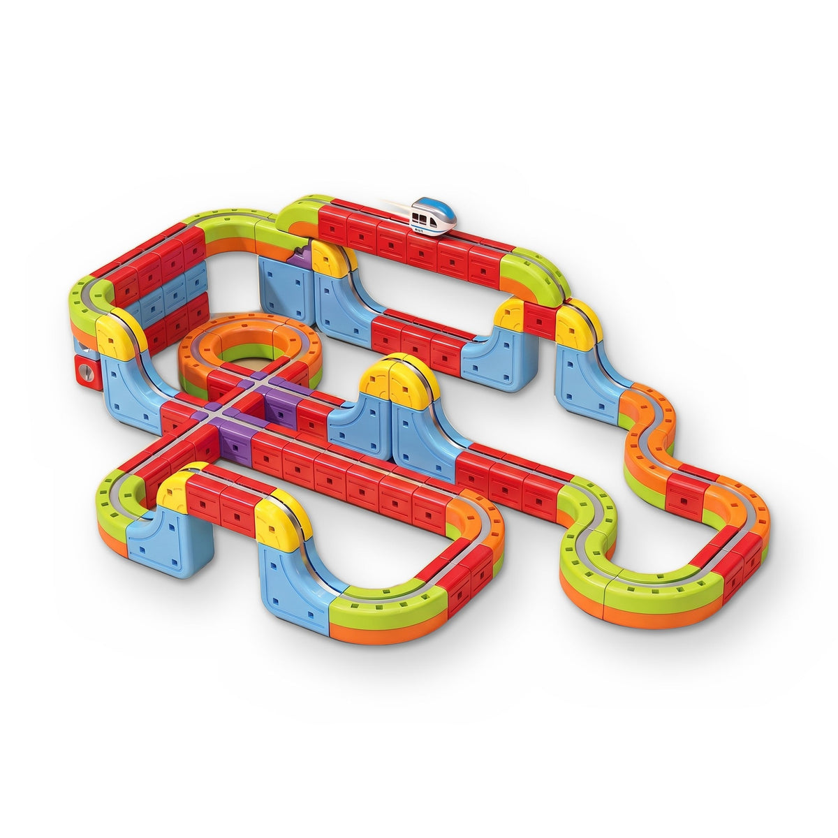 MagTrack Magnetic Train Track: a large layout of chunky track blocks with ramps, bridges, a crossing and a small white train